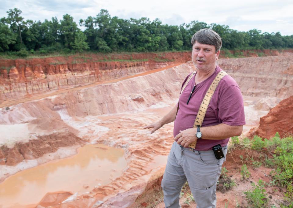 Jeff Ates IV talks about a borrow pit on his property in Milton on June 29.