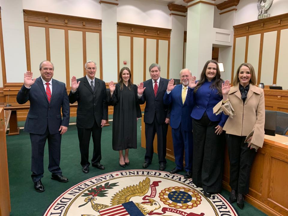 Six new members of the Tennessee Valley Authority board of directors took their oath collectively from a magistrate judge at the Howard H. Baker Jr. U.S. Courthouse Wednesday. From left are Wade White, Bobby Klein, Judge Jill E. McCook, Joe Ritch, Bill Renick, Michelle Moore and Beth Geer.