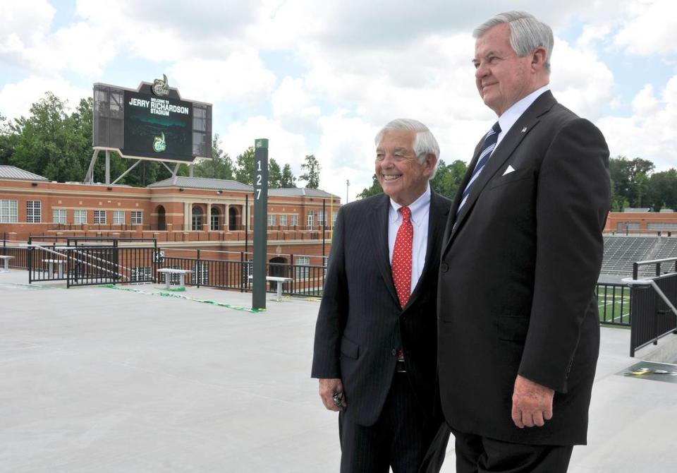 Businessmen Hugh McColl Jr. and Jerry Richardson stand in front of the Jerry Richardson Stadium and McColl-Richardson Field after a UNC Charlotte news conference to announce the naming of the 49ers’ new football stadium, which is called Jerry Richardson Stadium in honor of Richardson.