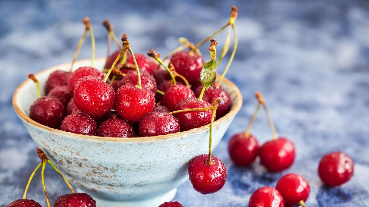 fresh wet ripe sour cherries in a bowl