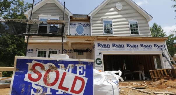 In this photo taken, June 8, 2015, a sold sign is displayed outside a new home under construction in Mechanicsville, Va. Freddie Mac, the mortgage company, releases weekly mortgage rates on Thursday, July 9, 2015. (AP Photo/Steve Helber)