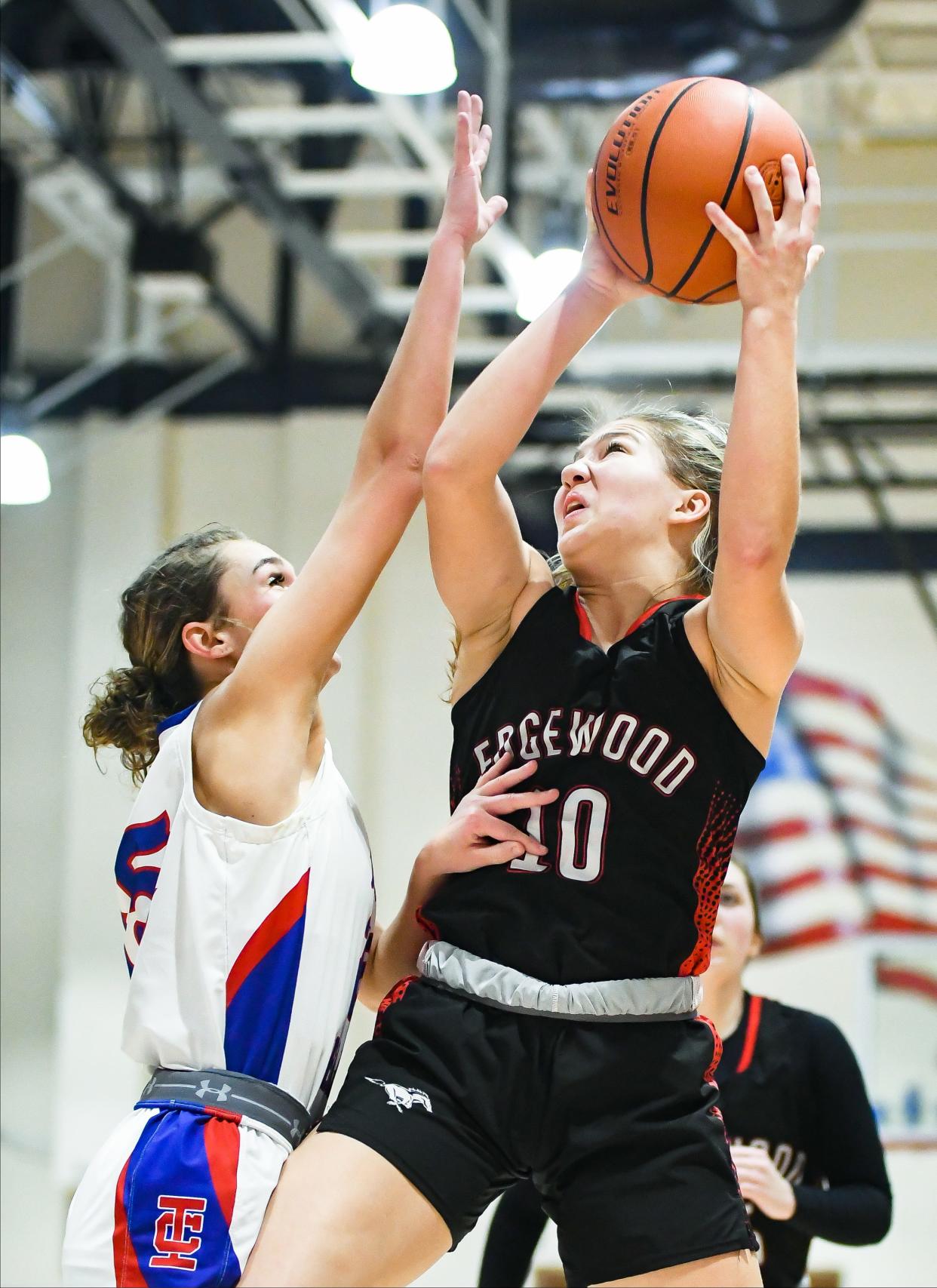 Edgewood’s Madi Bland (10) rebounds the ball against Indian Creek’s Olivia Pendleton (15) during their IHSAA sectional championship game at Owen Valley on Saturday, Feb. 3, 2024.