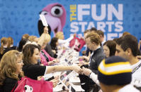 Valerie Deichert of Omaha, left, assists shareholders with their purchases from the Oriental Trading booth during the Berkshire Hathaway annual meeting on Saturday, May 4, 2024, in Omaha, Neb. (AP Photo/Rebecca S. Gratz)