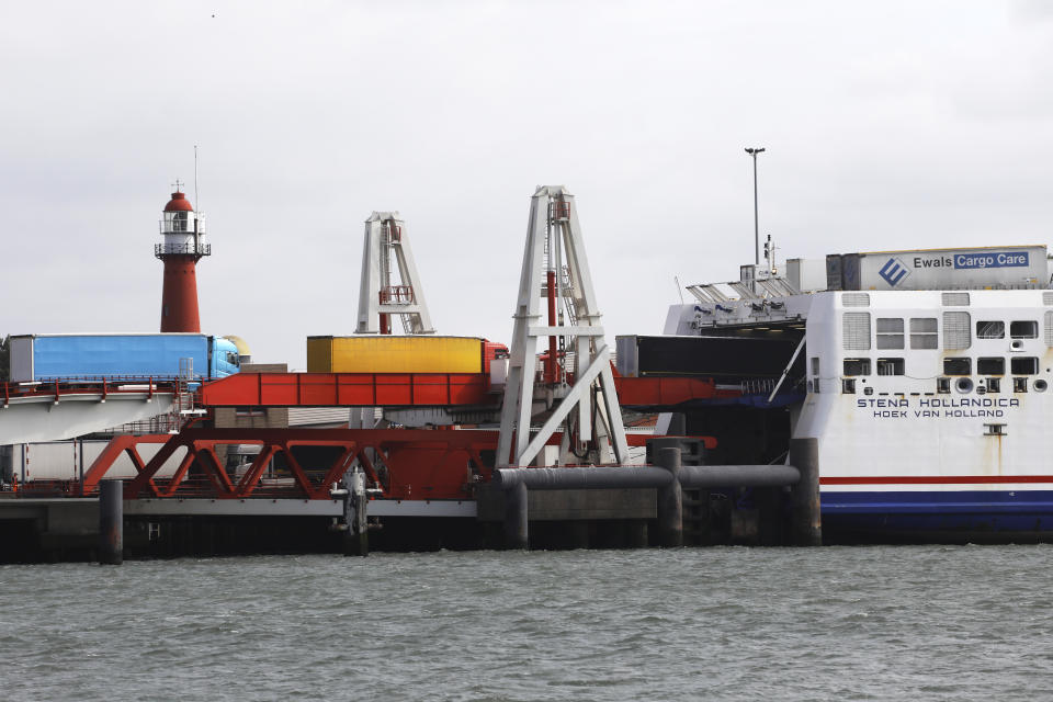 Trucks make their way onto a ferry in Hook of Holland terminal in the harbor of Rotterdam, Netherlands, Tuesday, Sept. 11, 2018. Gert Mulder of the Dutch Fresh Produce Center that supports some 350 traders and growers associations fears the worst if negotiators trying to hammer out a Brexit deal fail. One truck driver showing up at the docks without the proper paperwork "could throw it all into chaos," he says. (AP Photo/Peter Dejong)