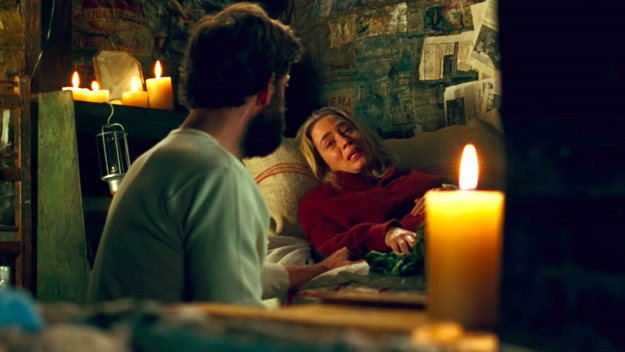 A woman cries and talks to a man while lying on a bed in "A Quiet Place"