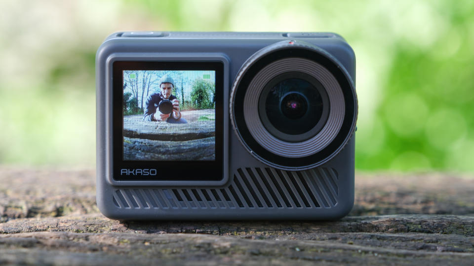 Akaso Brave 8 Lite action camera on a wooden surface outside