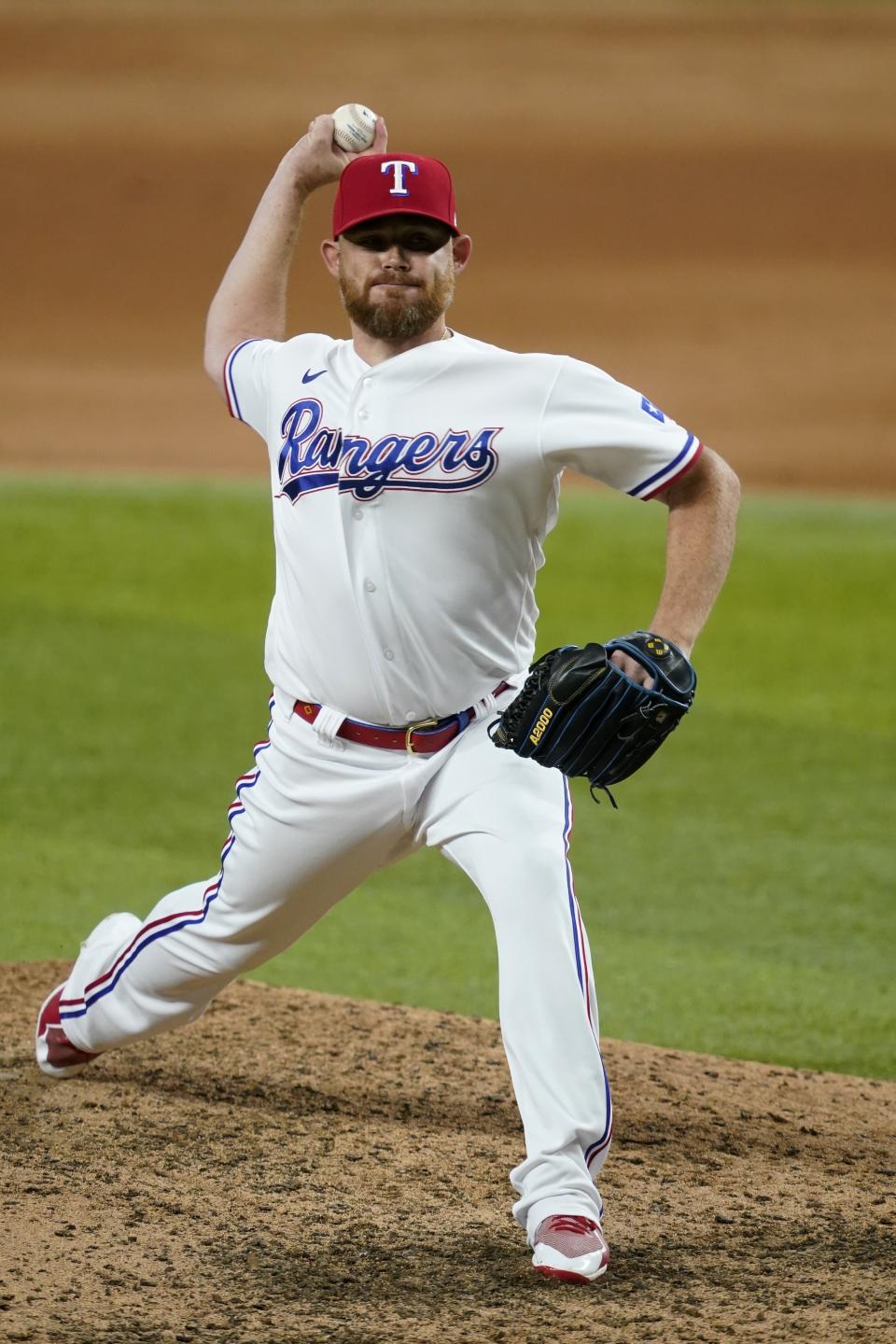 Texas Rangers closer Ian Kennedy throws to an Arizona Diamondbacks during the ninth inning of a baseball game in Arlington, Texas, Tuesday, July 27, 2021. (AP Photo/Tony Gutierrez)