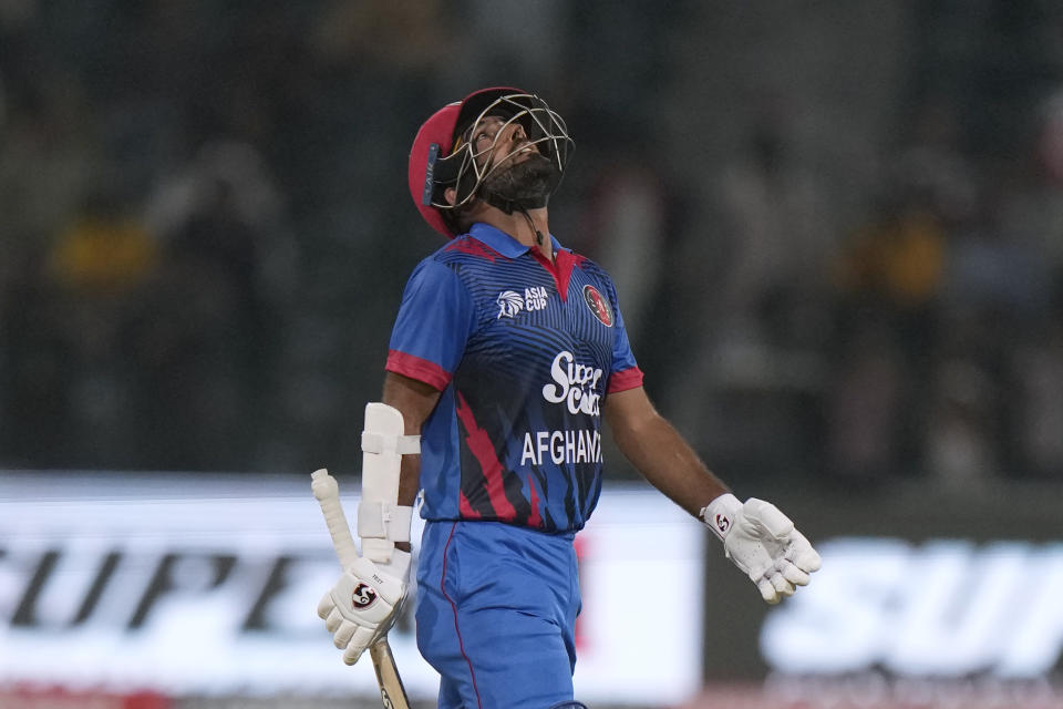 Afghanistan's Hashmatullah Shahidi reacts after scoring fifty during the Asia Cup cricket match between Bangladesh and Afghanistan in Lahore, Pakistan, Sunday, Sept. 3, 2023. (AP Photo/K.M. Chaudary)