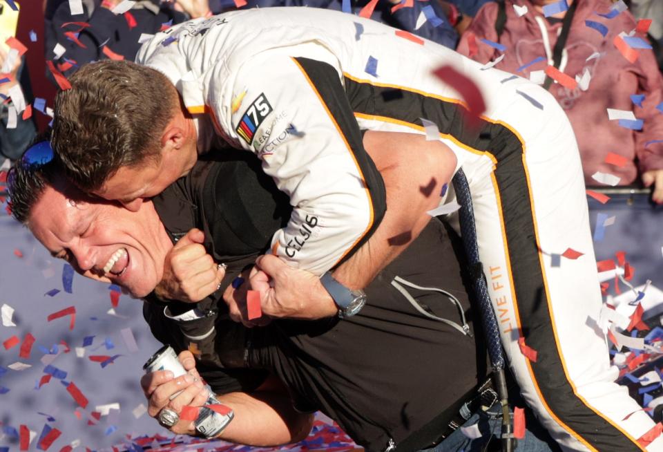 AJ Allmendinger jumps on the back of team owner Matt Kaulig after winning at the Charlotte Roval on Sunday.