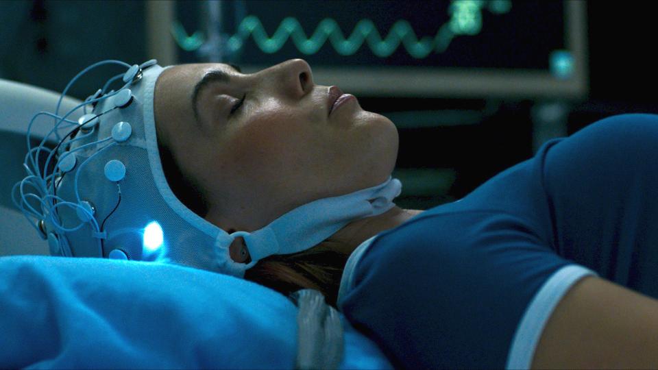 Carly Pope stars as a young woman coming into contact with supernatural forces via high-tech means in the horror movie "Demonic."
