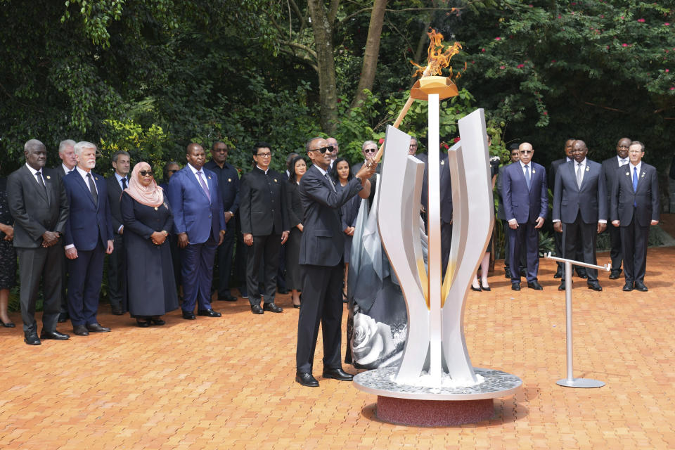 Rwandan President Paul Kagame lights a memorial flame during a ceremony to mark the 30th anniversary of the Rwandan genocide, held at the Kigali Genocide Memorial, in Kigali, Rwanda, Sunday, April 7, 2024. Rwandans are commemorating 30 years since the genocide in which an estimated 800,000 people were killed by government-backed extremists, shattering this small east African country that continues to grapple with the horrific legacy of the massacres. (AP Photo/Brian Inganga)