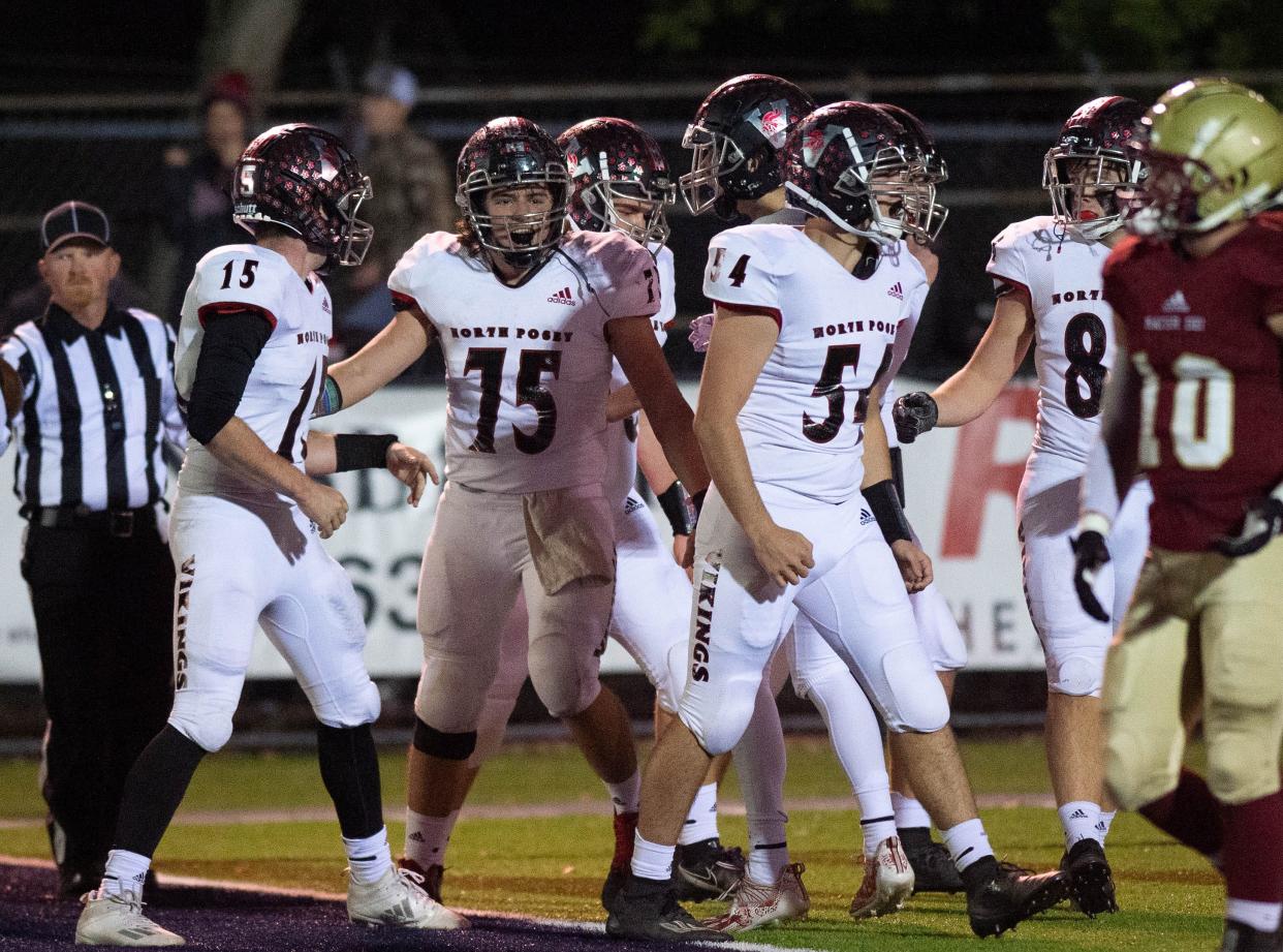 The North Posey offense celebrates a touchdown during the football game between the Mater Dei Wildcats and the North Posey Vikings at the Reitz Bowl in Evansville, Ind., Friday evening,  Nov. 5, 2021.