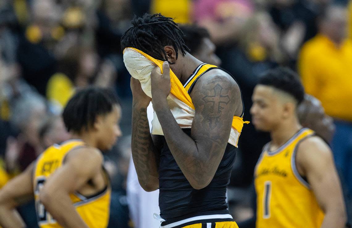 Wichita State’s Jaykwon Walton hides his face after the Shockers lost to San Francisco in the final of the Hall of Fame Classic in Kansas City on Tuesday. Walton had 21 points, but committed a crucial turnover late in the game.