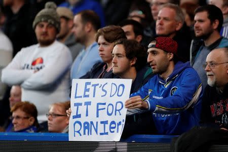 Britain Football Soccer - Chelsea v Tottenham Hotspur - Barclays Premier League - Stamford Bridge - 2/5/16 A Chelsea fan displays a banner in reference to Leicester City manager Claudio Ranieri Action Images via Reuters / John Sibley