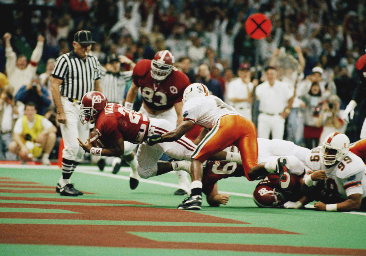 Alabama running back Sherman Williams (20) dives into the end zone for a 2-yard touchdown during the second quarter of the Sugar Bowl at the Superdome, Friday, Jan. 1, 1993, New Orleans, La. (AP Photo/Bill Feig)