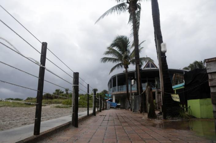 Tropical Storm Elsa churns slowly up the Gulf Coast at Venice Beach, FL