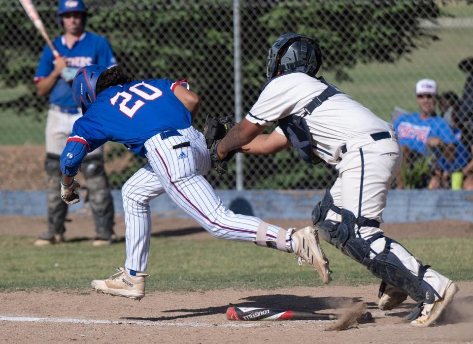 Central Catholic’s Fernando Alaniz tags out Christian Brothers’ Philip Barretto during the Division III Sac-Joaquin Section playoff game with Christian Brothers at Central Catholic High School in Modesto, Calif., Wednesday, May 17, 2023. The Raiders won the game 8-1.