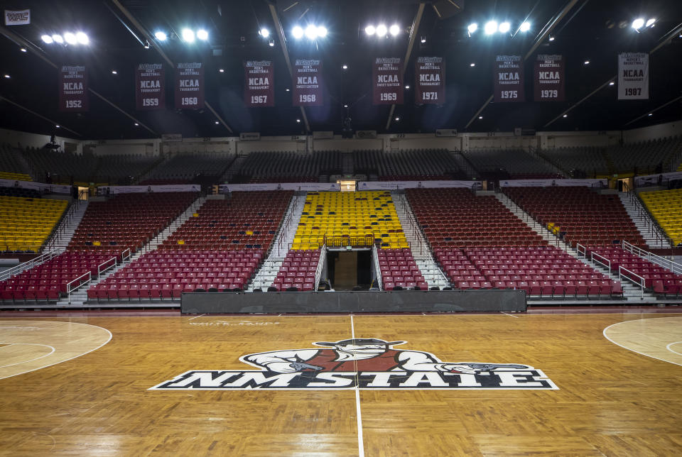 The basketball court of the Pan American Center at New Mexico State University is seen Wednesday, Feb. 15, 2023, in Las Cruces, N.M. The remainder of the men's basketball team's season has been canceled, and the team's coach fired. (AP Photo/Andrés Leighton)