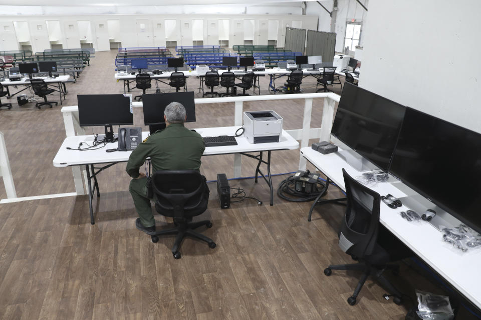 In this photo provided by the U.S. Customs and Border Protection is an interior view of the soft-sided migrant processing facility in Laredo, Texas, on Sept. 23, 2021. As the Biden administration prepared to launch speedy asylum screenings at the border in April, authorities pledged a key difference from a Trump-era version of the policy: Migrants would be guaranteed access to legal representation. Nearly three months and thousands of screenings later, the promise of attorney access appears unfulfilled. (Greg L. Davis/U.S. Customs and Border Protection via AP)