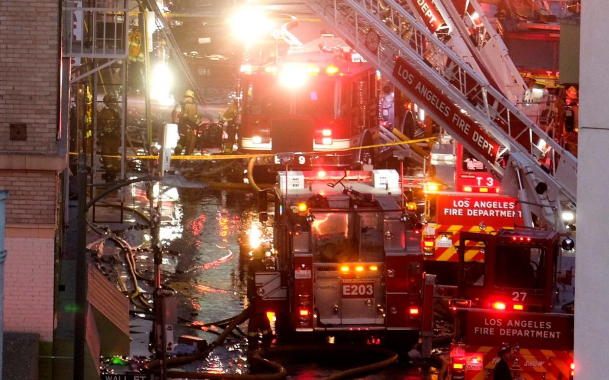 Emergency services respond to an explosion in downtown Los Angeles that has injured firefighters - AP Photo/Ringo H.W. Chiu