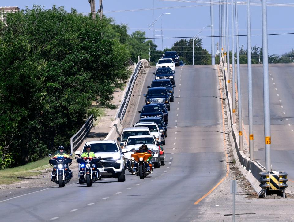 A parade of cars crosses the Martin Luther King Jr. Memorial Bridge on their way to Stevenson Park last June.