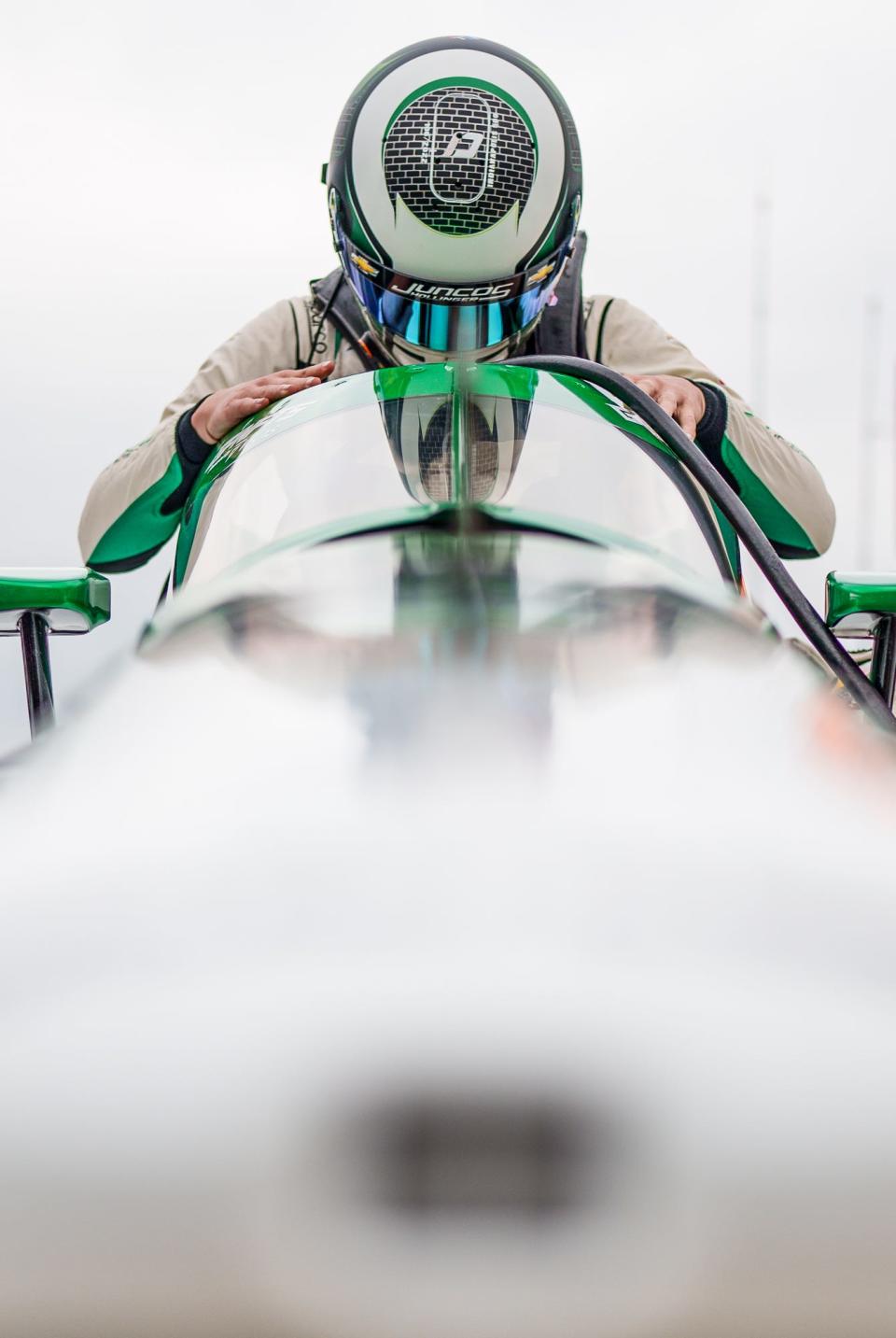 Juncos Hollinger Racing driver Callum Ilott (77) sits down into his car Saturday, May 21, 2022, during a morning practice session before qualifying for the 106th running of the Indianapolis 500 at Indianapolis Motor Speedway.