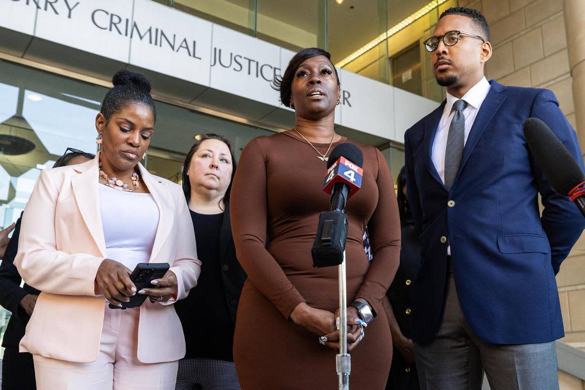 Crystal Mason, center, and her attorneys speak to the media gathered regarding her acquittal in a high-profile voting rights case at the Tim Curry Criminal Justice Center in Fort Worth on Friday, March 29, 2024. The Texas Second Court of Appeals reversed Mason’s conviction on Thursday evening where she had faced five years in prison for submitting a provisional ballot in Tarrant County in 2016 that was never counted as a vote