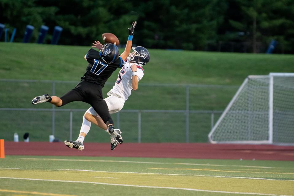 Central Bucks South defensive back Owen Wheeler breaks up a pass intended for Central Bucks East wide receiver Matt LaBouliere in a football game at Central Bucks South High School in Warrington on Friday, September 16, 2022. The Patriots delivered for a 21-7 win against the Titans.
