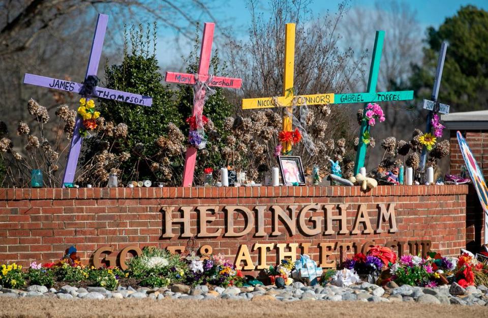 Five crosses memorialize the victims of the mass shooting at the entrance to the Hedingham neighborhood on Friday, January 13, 2023 in Raleigh, N.C. Victims James Thompson, Mary Marshall, Nicole Connors, Raleigh Police Officer Gabriel Torres and Susan Karnatz all lost their lives in the mass shooting on October 13, 2022.