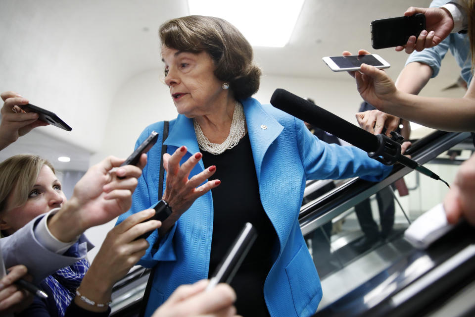 Sen. Dianne Feinstein, D-Calif., is surrounded by reporters as she arrives for a vote, Tuesday, Sept. 18, 2018, on Capitol Hill in Washington. (AP Photo/Jacquelyn Martin)