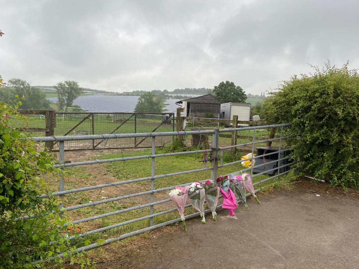 Flowers have been laid near where a young woman was found fatally injured