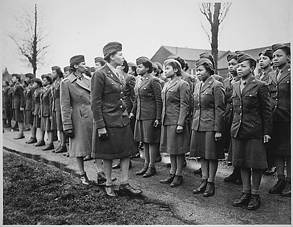 Charity E. Adams inspects members of the 688 assigned to overseas service.  / Credit: National Archives
