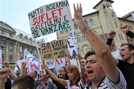 Protesters shout slogans during a demonstration against the opening of the Rosia Montana open cast gold mine in Bucharest September 1, 2013. REUTERS/Radu Sigheti