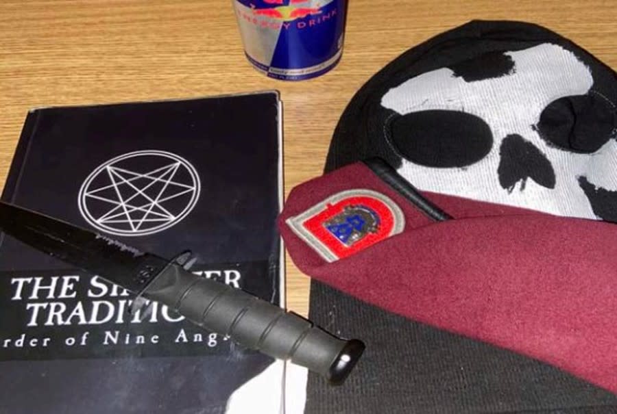 This photo provided by the Department of Justice seized from an iCloud account belonging to U.S. Army Pvt. Ethan Melzer displays personal effects, including paraphernalia associated with the extremist group Order of the Nine Angles. (DOJ)  