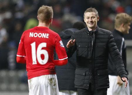 Cardiff City manager Ole Gunnar Solskjaer congratulates player Craig Noone after their English FA Cup soccer match against Newcastle United at St James' Park stadium in Newcastle, northern England January 4, 2014. REUTERS/Russell Cheyne