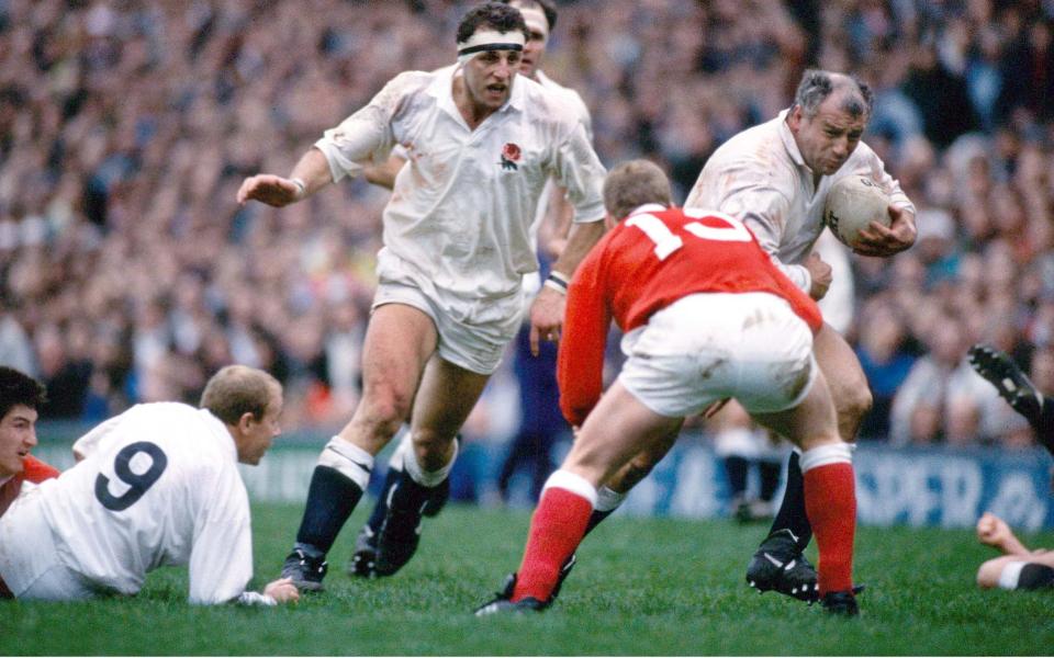 Rendall powers towards the Welsh line with Wade Dooley in support in England's 34-6 victory in 1990 - Colorsport/Shutterstock