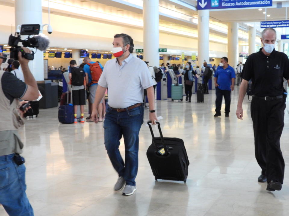 Sen. Ted Cruz (R-TX) checks in for a flight at Cancun International Airport. (Photo by MEGA/GC Images)