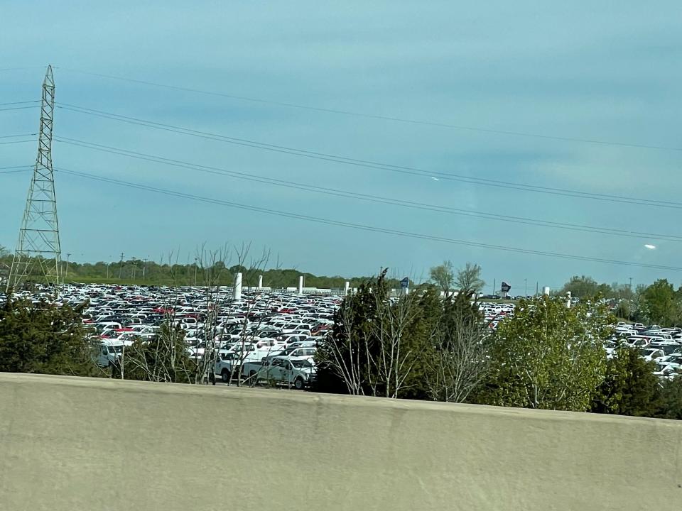 Thousands of pickup trucks could be seen from Interstate 71 in Sparta, Ky., on Sunday. Ford Motor Co. had approximately 22,000 vehicles at the end of March primarily in North America awaiting installation of chip-related components, Chief Financial Officer John Lawler said during a first-quarter earnings call with analysts on April 28, 2021.