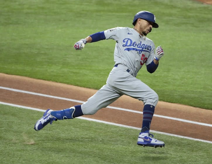 Arlington, Texas, Sunday, October 25, 2020 Los Angeles Dodgers right fielder Mookie Betts (50) hustles to second base for a double in game five of the World Series at Globe Life Field. (Robert Gauthier/ Los Angeles Times)