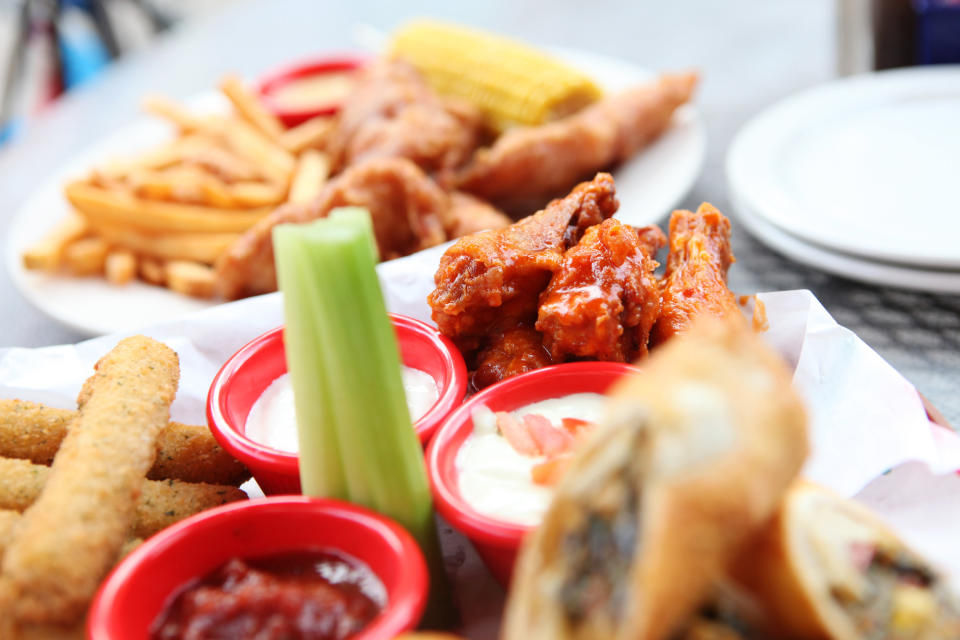 Chicken wings with dipping sauces.