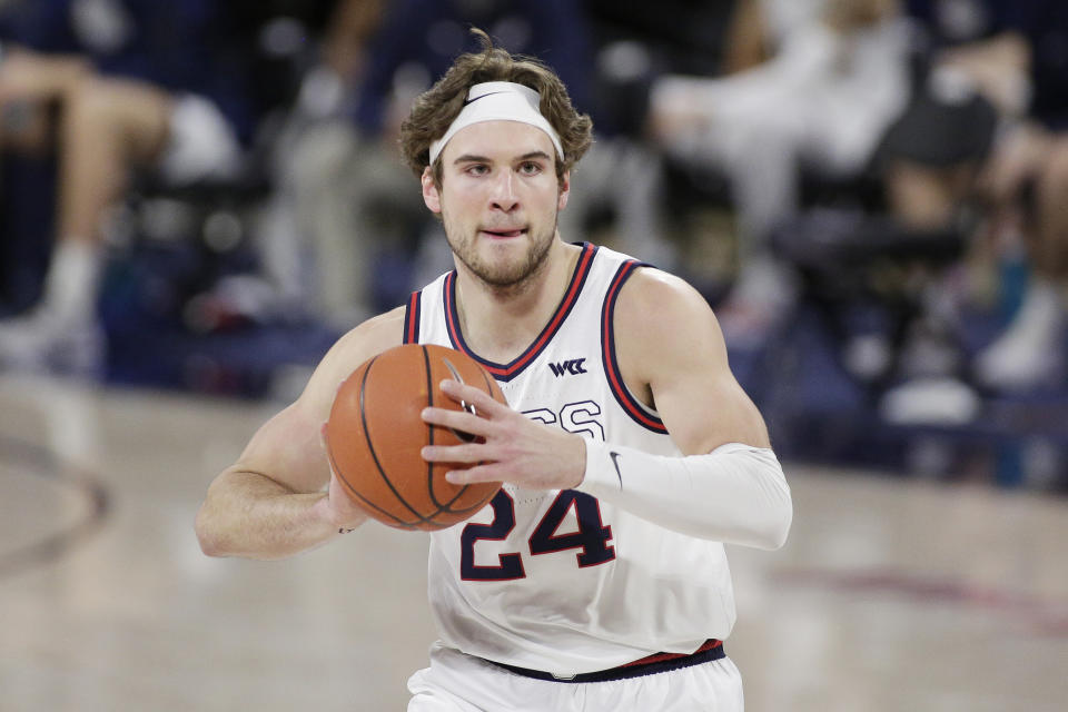 FILE - Gonzaga forward Corey Kispert prepares to pass the ball during the first half of an NCAA college basketball game against Loyola Marymount in Spokane, Wash., in this Saturday, Feb. 27, 2021, file photo. Kispert has made The Associated Press All-America first team, announced Tuesday, March 16, 2021. (AP Photo/Young Kwak, File)