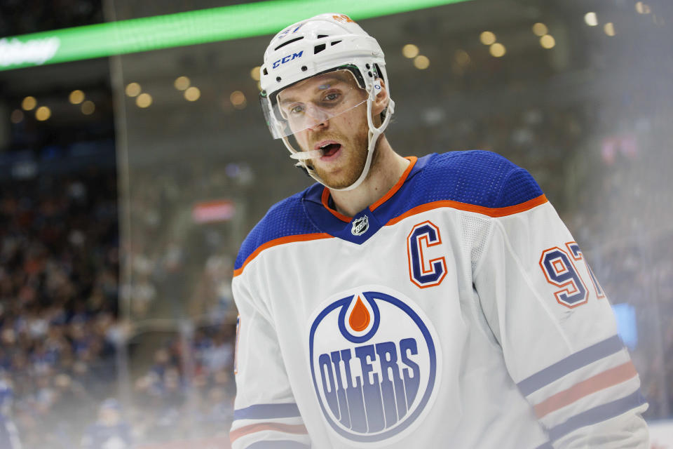 Edmonton Oilers centre Connor McDavid (97) skates the ice during a break in play against the Toronto Maple Leafs during the third period of an NHL hockey game Saturday, March 11, 2023, in Toronto. (Cole Burston/The Canadian Press via AP)