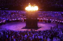 The Olympic cauldron is lit during the Opening Ceremony at the 2012 Summer Olympics, Saturday, July 28, 2012, in London. (AP Photo/Mark Baker)