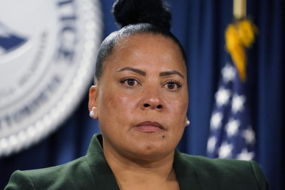 FILE - U.S. Attorney Rachael Rollins, for the Massachusetts Disctrict, listens during a news conference at the Moakley Federal Courthouse, May 24, 2022, in Boston. Rollins' attorney says she will resign after a monthslong ethics investigation by the Justice Department's inspector general into her appearance at a political fundraiser and other potential issues. (AP Photo/Charles Krupa)