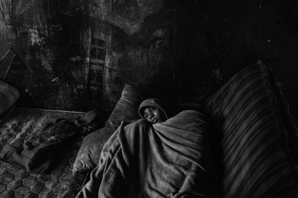 A Moroccan boy wakes up under a bridge in the city of Melilla in March. (Photo: José Colón/MeMo/Sony for Yahoo News)