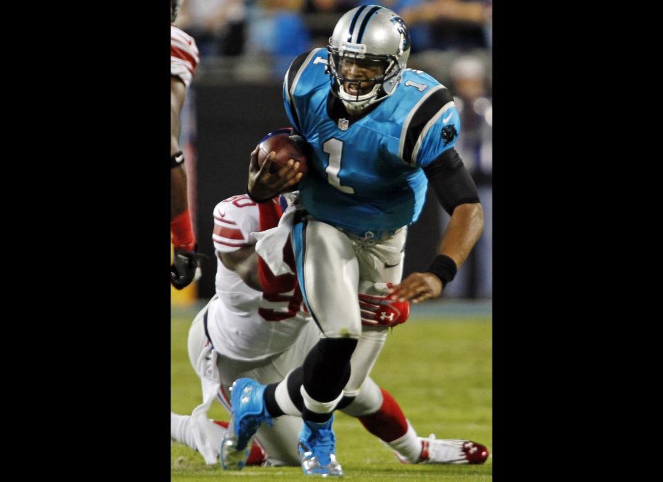 Carolina Panthers quarterback Cam Newton (1) is sacked by New York Giants defensive end Jason Pierre-Paul (90) during the first quarter of an NFL football game in Charlotte, N.C., Thursday, Sept. 20, 2012.