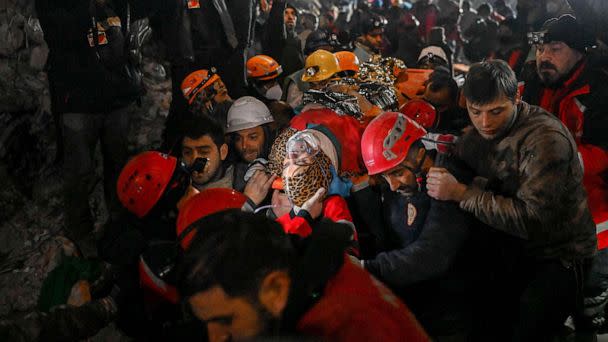 PHOTO: Seher, a 15 year-old Syrian woman saved by rescue workers from under the rubble after 210 hours, is carried to an ambulance in Hatay, southeastern Turkey, Feb. 14, 2023, a week after a deadly earthquake struck parts of Turkey and Syria. (Bulent Kilic/AFP via Getty Images)