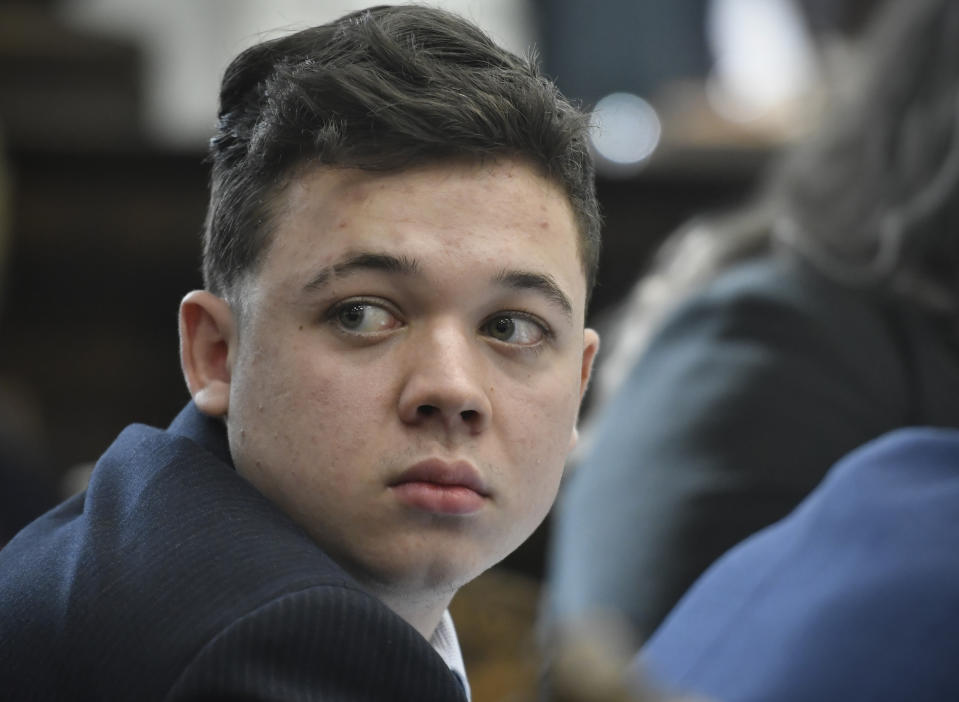 FILE -Kyle Rittenhouse looks back as Susan Hughes, the great aunt of Anthony Huber, enters the courtroom during his trial at the Kenosha County Courthouse in Kenosha, Wis., on Friday, Nov. 5, 2021. On Friday, Dec. 3, The Associated Press reported on stories circulating online incorrectly claiming the Federal magistrate approved Kyle Rittenhouse’s $110 Million defamation suit against LeBron James. (Sean Krajacic/The Kenosha News via AP, File, Pool, File)