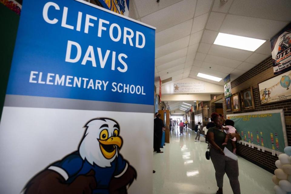 Students arrive to campus on the first day of school at Clifford Davis Elementary School in Fort Worth.