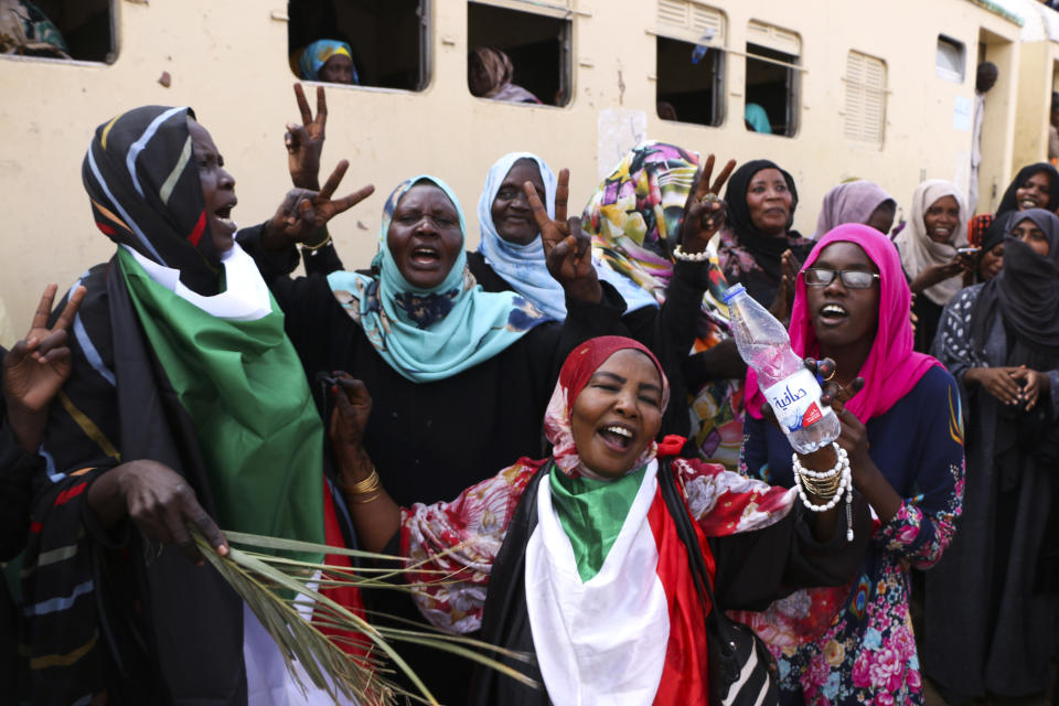 FILE - In this Saturday, Aug. 17, 2019 file photo, Sudanese pro-democracy supporters celebrate a final power-sharing agreement with the ruling military council, in the capital, Khartoum. For the first time in three decades, Sudan has charted a path out of military rule with the formation of a transitional government in which power is shared with civilians. But the fragile transition will be tested as leaders confront a daunting array of challenges. (AP Photo, File)